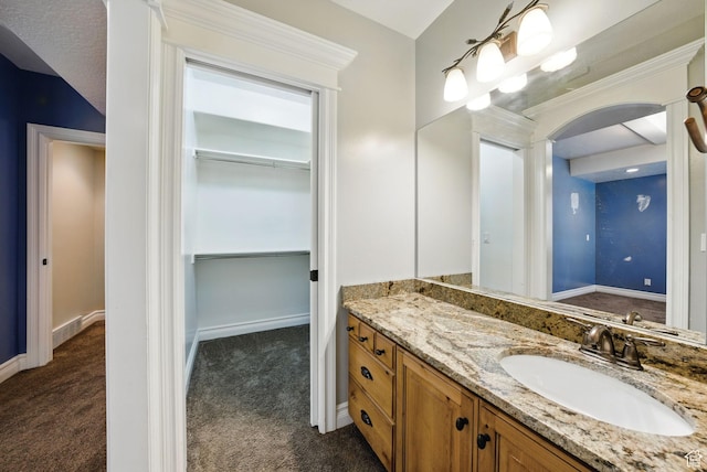 62 W 225 N, Lindon, UT 84042 - bathroom with vanity, a walk in closet, and baseboards