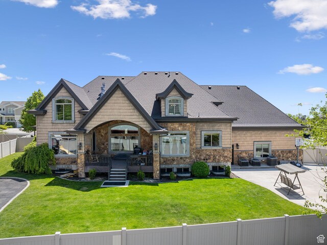 62 W 225 N, Lindon, UT 84042 - back of house featuring a patio area, stone siding, and a shingled roof