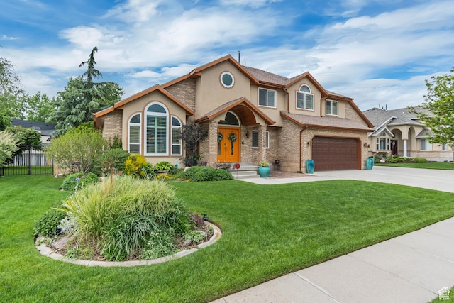 11198 S Wyngate Ln E, Sandy, UT 84092 - view of front facade featuring stucco siding, concrete driveway, brick siding, and an attached garage