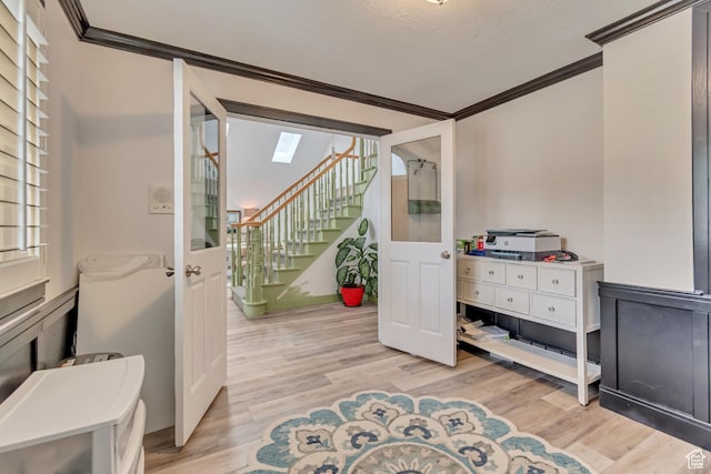 11198 S Wyngate Ln E, Sandy, UT 84092 - home office with ornamental molding, light wood-style flooring, and a skylight