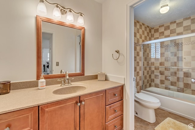 11198 S Wyngate Ln E, Sandy, UT 84092 - full bath with vanity, toilet, tile patterned floors, and shower / bath combination with glass door