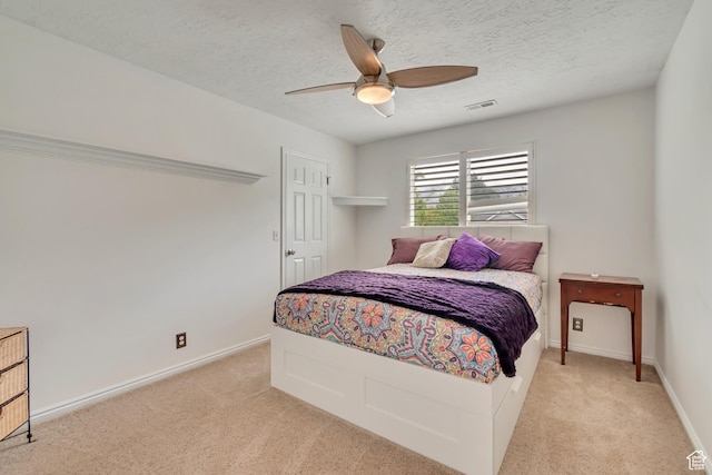 11198 S Wyngate Ln E, Sandy, UT 84092 - bedroom with light colored carpet, a ceiling fan, a textured ceiling, and baseboards