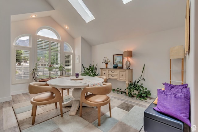 11198 S Wyngate Ln E, Sandy, UT 84092 - dining area featuring a skylight, high vaulted ceiling, baseboards, and recessed lighting