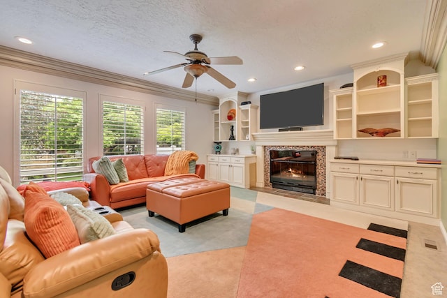 11198 S Wyngate Ln E, Sandy, UT 84092 - living room featuring ceiling fan, crown molding, recessed lighting, a tile fireplace, and light colored carpet