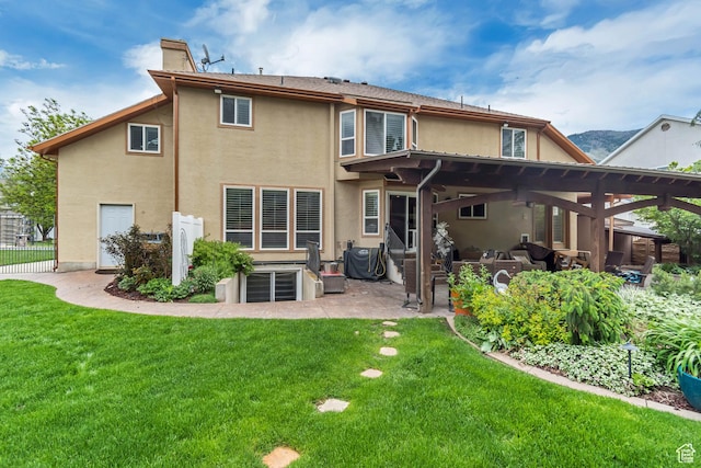 11198 S Wyngate Ln E, Sandy, UT 84092 - back of house with stucco siding, a chimney, and a patio