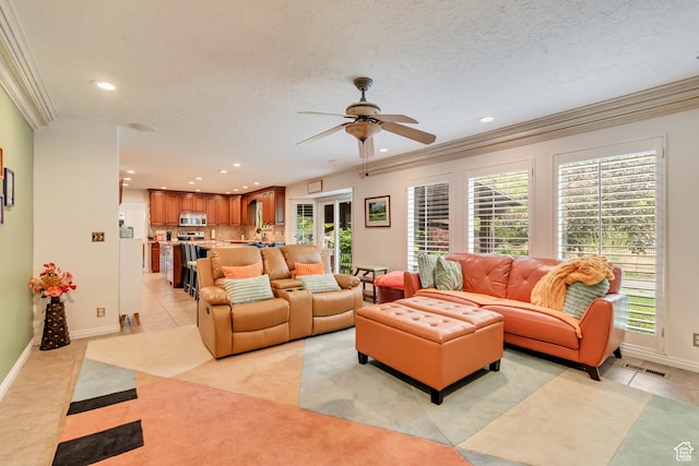 11198 S Wyngate Ln E, Sandy, UT 84092 - living room with a ceiling fan, recessed lighting, crown molding, baseboards, and light carpet