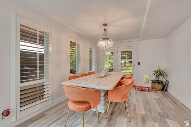 11198 S Wyngate Ln E, Sandy, UT 84092 - dining space with a chandelier, light wood-style floors, and baseboards