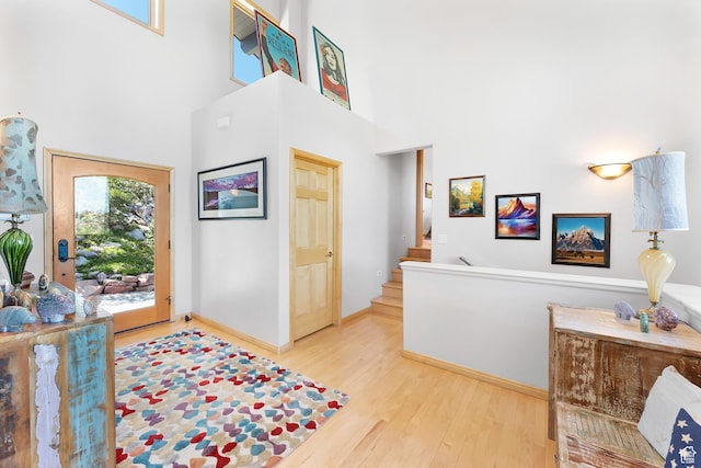 7340 Buckboard Dr N, Park City, UT 84098 - entrance foyer with a towering ceiling, wood finished floors, stairs, and baseboards