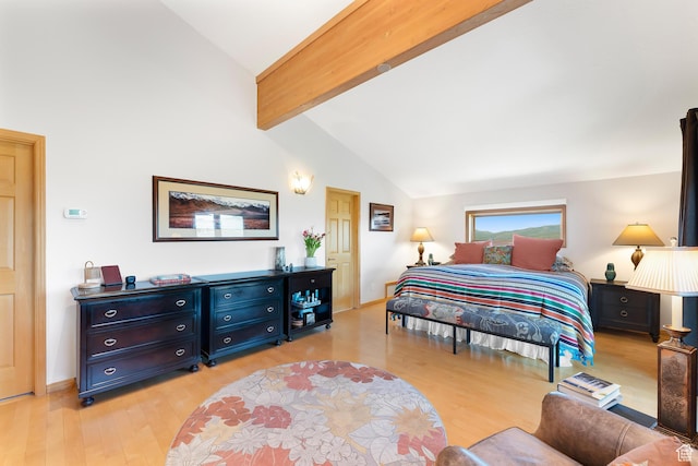 7340 Buckboard Dr N, Park City, UT 84098 - bedroom with light wood finished floors, beamed ceiling, baseboards, and high vaulted ceiling