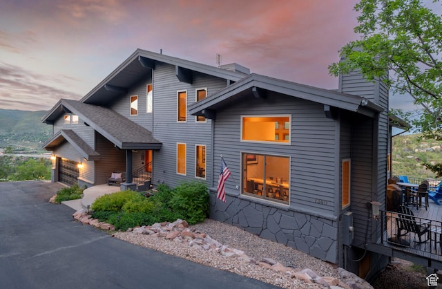 7340 Buckboard Dr N, Park City, UT 84098 - contemporary home with a chimney, a garage, and driveway