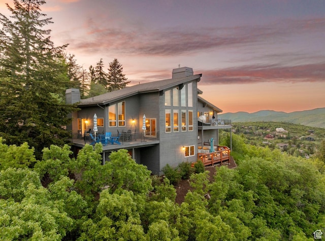 7340 Buckboard Dr N, Park City, UT 84098 - back of property with a chimney, a balcony, and a mountain view