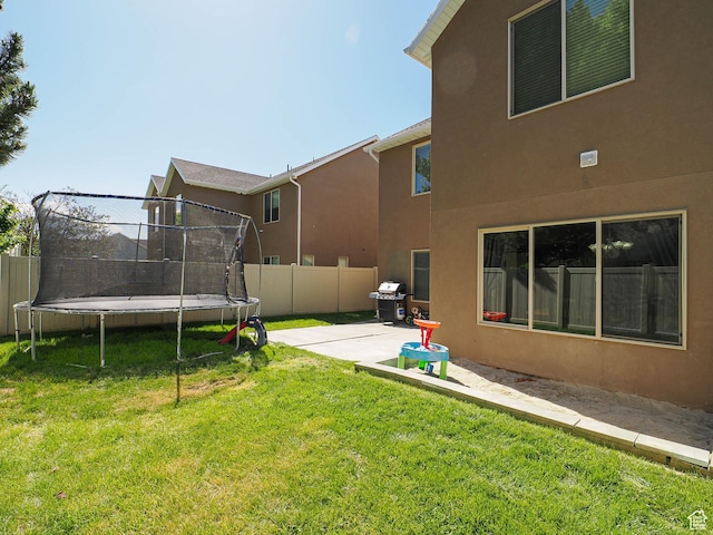385 E 570 S, American Fork, UT 84003 - view of yard featuring a trampoline and a patio area