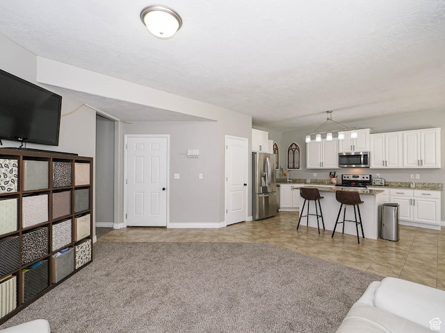 385 E 570 S, American Fork, UT 84003 - living area with baseboards, light tile patterned floors, and a textured ceiling