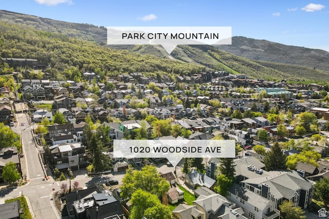 1020 Woodside Ave, Park City, UT 84060 - aerial overview of property's location with a mountain backdrop and nearby suburban area