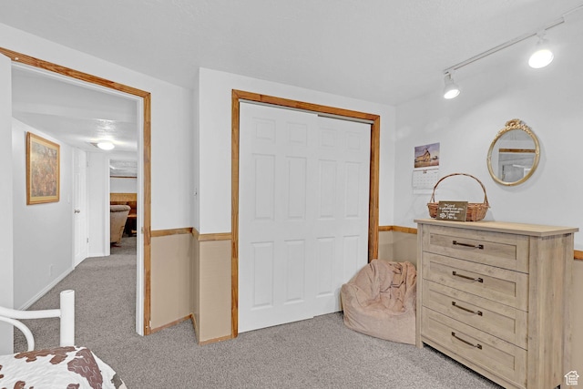 3966 W 2200 N, Plain City, UT 84404 - bedroom with light colored carpet, rail lighting, a closet, and baseboards
