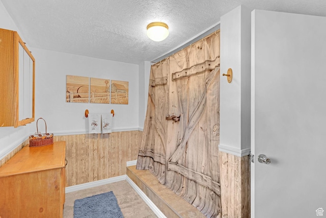 3966 W 2200 N, Plain City, UT 84404 - bathroom featuring a textured ceiling and wood walls