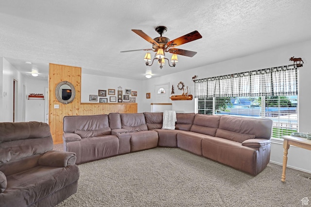 3966 W 2200 N, Plain City, UT 84404 - carpeted living area with wooden walls, ceiling fan, and a textured ceiling