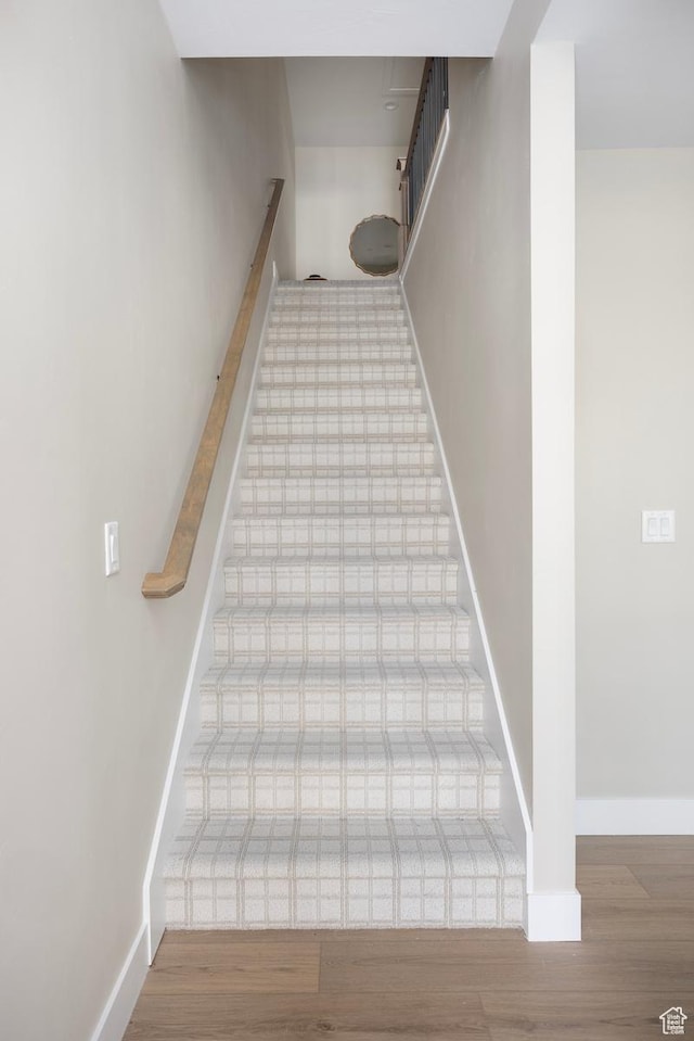 1562 E 3900 S Unit 106, Millcreek, UT 84124 - staircase featuring wood finished floors and baseboards