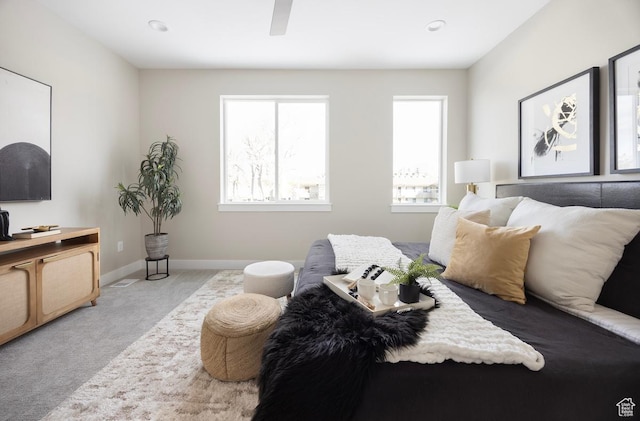 1562 E 3900 S Unit 106, Millcreek, UT 84124 - carpeted bedroom featuring multiple windows, baseboards, and ceiling fan
