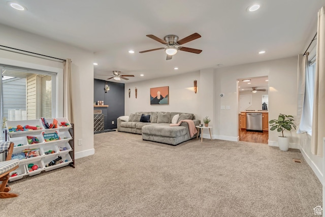 2867 S Cyprus Ln, Magna, UT 84044 - living area with carpet floors, a ceiling fan, recessed lighting, a fireplace, and baseboards
