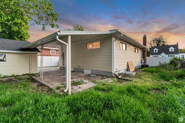 2867 S Cyprus Ln, Magna, UT 84044 - back of property at dusk with a patio