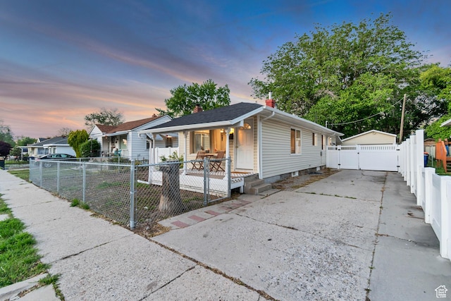 2867 S Cyprus Ln, Magna, UT 84044 - shotgun-style home featuring a gate, a porch, and a chimney