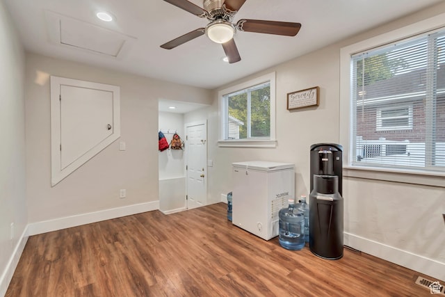 2867 S Cyprus Ln, Magna, UT 84044 - empty room featuring plenty of natural light, wood finished floors, baseboards, attic access, and recessed lighting