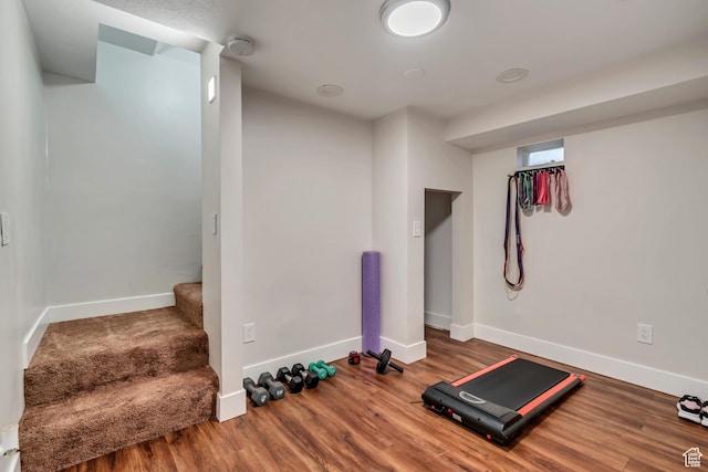 2867 S Cyprus Ln, Magna, UT 84044 - workout room featuring baseboards and wood finished floors
