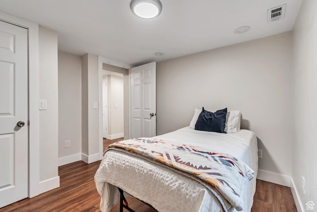 2867 S Cyprus Ln, Magna, UT 84044 - bedroom featuring baseboards and dark wood-style floors
