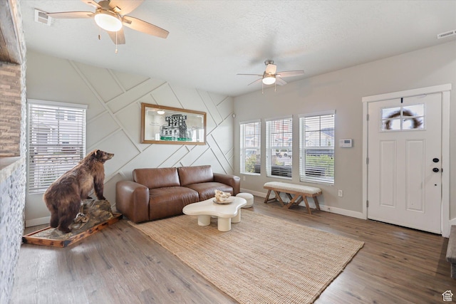 702 E 330 N, Vineyard, UT 84059 - living area featuring ceiling fan, plenty of natural light, wood finished floors, baseboards, and a textured ceiling