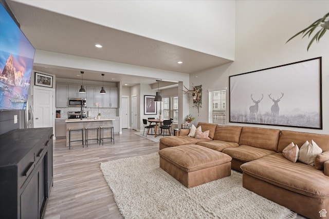 702 E 330 N, Vineyard, UT 84059 - living room featuring light wood-type flooring and recessed lighting