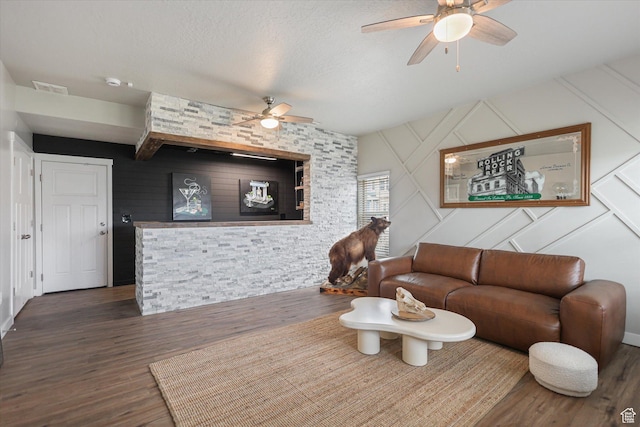 702 E 330 N, Vineyard, UT 84059 - living area with ceiling fan, wood finished floors, a textured ceiling, and a decorative wall