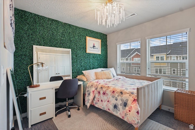 702 E 330 N, Vineyard, UT 84059 - bedroom featuring a chandelier, wallpapered walls, an office area, baseboards, and a textured ceiling