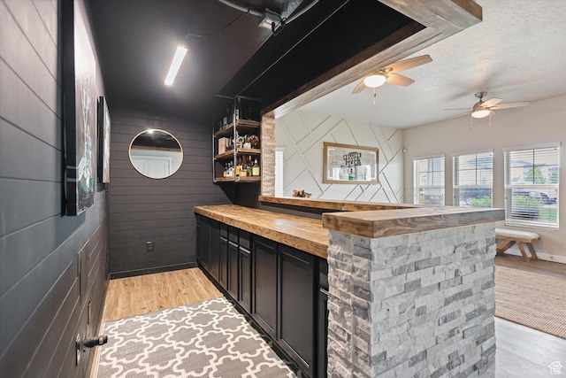 702 E 330 N, Vineyard, UT 84059 - indoor dry bar featuring wood walls, a ceiling fan, light wood-type flooring, and a textured ceiling