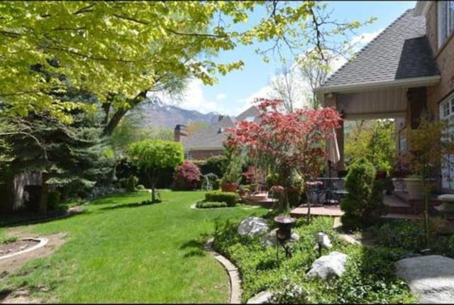 2051 E Normandywoods Ct, Holladay, UT 84117 - view of green lawn featuring a patio