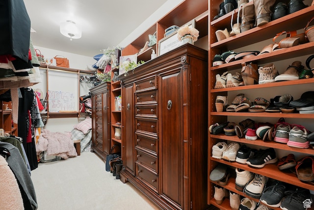 2051 E Normandywoods Ct, Holladay, UT 84117 - walk in closet featuring light colored carpet
