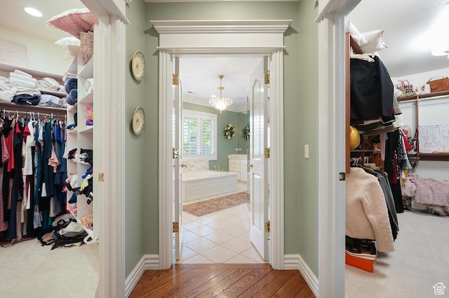 2051 E Normandywoods Ct, Holladay, UT 84117 - spacious closet with a chandelier and wood-type flooring