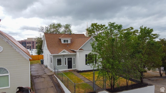 2213 Ogden Ave, Ogden, UT 84401 - view of front of property with a fenced front yard, a gate, and a shingled roof