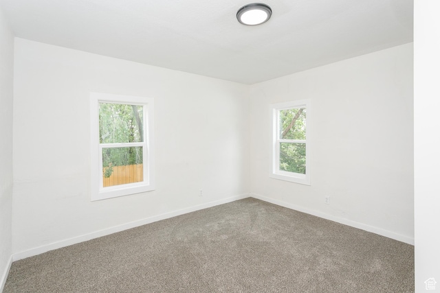 2213 Ogden Ave, Ogden, UT 84401 - carpeted spare room featuring healthy amount of natural light and baseboards