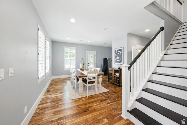 10416 S Vermillion Dr W, South Jordan, UT 84009 - dining space with wood finished floors, stairway, baseboards, and recessed lighting