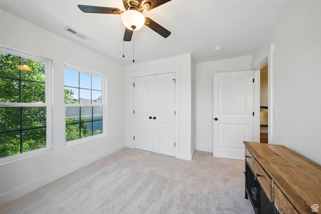 10416 S Vermillion Dr W, South Jordan, UT 84009 - unfurnished bedroom featuring light colored carpet, baseboards, ceiling fan, and a closet