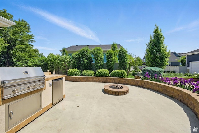 10416 S Vermillion Dr W, South Jordan, UT 84009 - view of patio featuring an outdoor fire pit