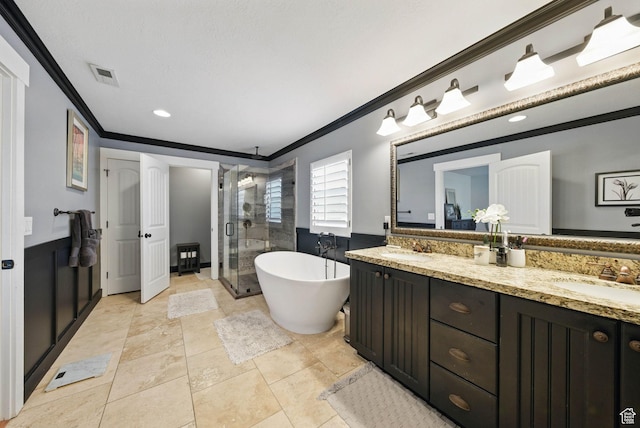 10416 S Vermillion Dr W, South Jordan, UT 84009 - bathroom featuring ornamental molding, a shower stall, double vanity, a freestanding bath, and recessed lighting