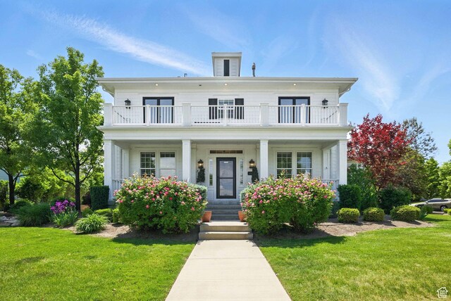 10416 S Vermillion Dr W, South Jordan, UT 84009 - neoclassical home featuring a balcony, covered porch, and a front lawn