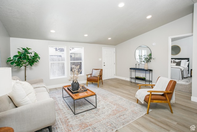1623 W Claybourne Ave S, West Valley City, UT 84119 - living room with light wood finished floors, recessed lighting, and baseboards