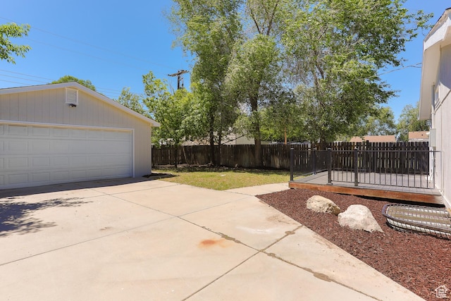 1623 W Claybourne Ave S, West Valley City, UT 84119 - fenced backyard with an outdoor structure and a detached garage