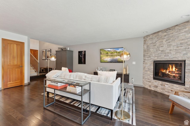 2464 Deer Lake Dr, Park City, UT 84060 - living room featuring dark wood finished floors, stairway, a stone fireplace, and baseboards