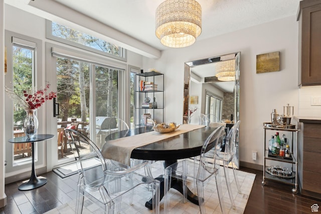 2464 Deer Lake Dr, Park City, UT 84060 - dining room with a chandelier, wood finished floors, and baseboards