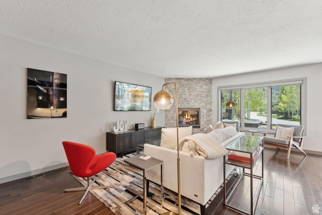 2464 Deer Lake Dr, Park City, UT 84060 - living area with wood-type flooring, a textured ceiling, a fireplace, and baseboards