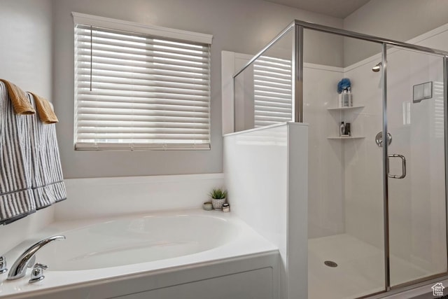 2076 E Granite Ln N Unit 145, Eagle Mountain, UT 84005 - bathroom with a bath, a shower stall, and plenty of natural light